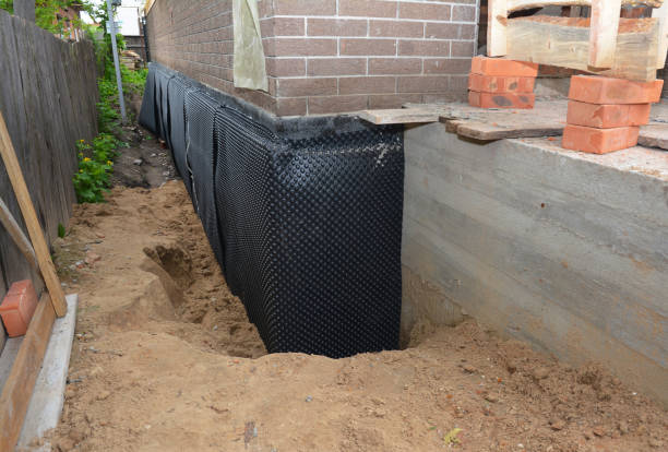 Happy homeowners after waterproofing job in Wayland